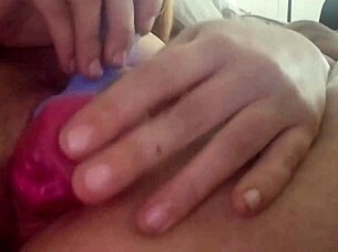She fucks herself with a dildo