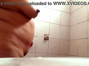 Watch this chubby milf with big tits shower and exhibit herself!