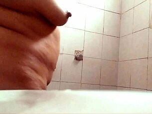 Watch this chubby milf with big tits shower and exhibit herself!