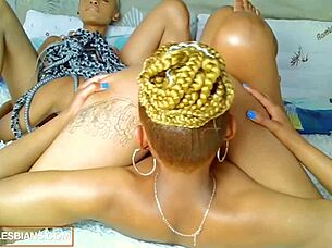 African lesbians enjoy a homemade threesome with massages and orgasms.