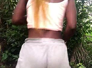 Crazy bitch twerks in sexy clothes, revealing small cute tits.