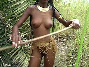 hot african native woman cooking in the jungle kitchen