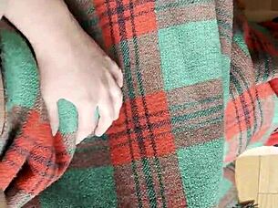 My shy neighbor performs cunnilingus under the blanket in this homemade lesbian scene.