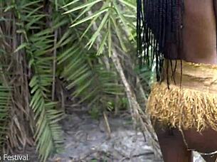 hot african native woman cooking in the jungle kitchen