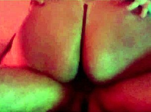 The pretty girl enjoys a fun party with friends under red lights