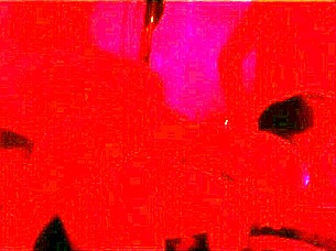 The pretty girl enjoys a fun party with friends under red lights