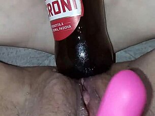 gretala, pregnant and excited, rubs a bottle on her pussy