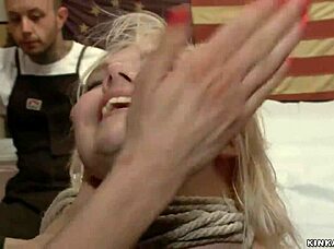 Woman receives deep throat in tattoo shop.