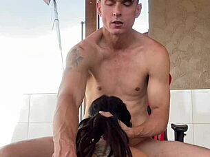 Tattooed teen gives sloppy blowjob on balcony