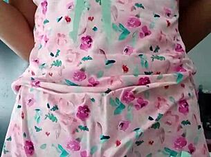 Beautiful latina model poses in pink pajamas