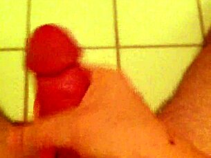 Detailed scene of a guy wanking in the toilet