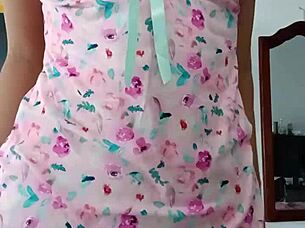 Beautiful latina model poses in pink pajamas