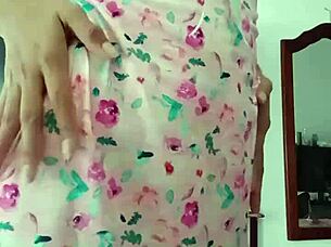 Beautiful latina model poses in pink pajamas