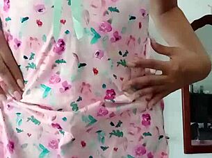 Beautiful latina model poses in pink pajamas