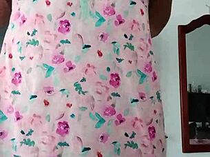 Beautiful latina model poses in pink pajamas