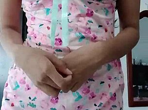 Beautiful latina model poses in pink pajamas