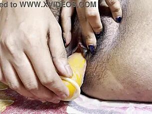 College girl fingers her pussy with oil.