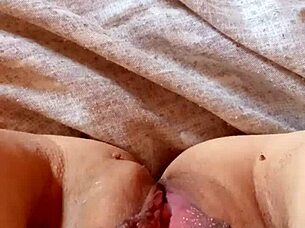 Milf spreads her pussy wide open.