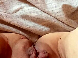 Milf spreads her pussy wide open.