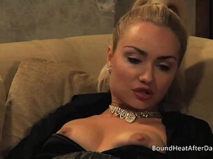 The mistress and handmaiden in a bdsm scene, with the mistress masturbating