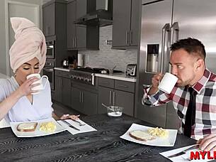 sensual housewife prepares breakfast for her man in romantic setting.