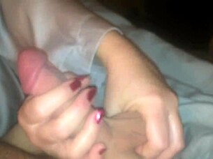 Wife gives emotional handjob to husband's monster cock.