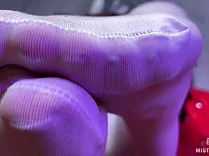 Goddess Teases Big Booty and Feet in White Stockings on Red Sofa