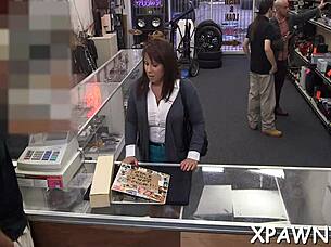 Couple engages in sloppy cock sucking in shop.