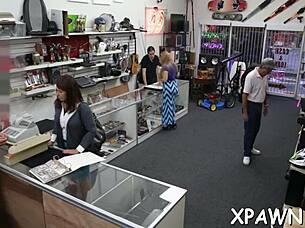 Couple engages in sloppy cock sucking in shop.