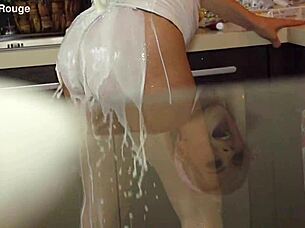 Beautiful housewife prepares in the kitchen