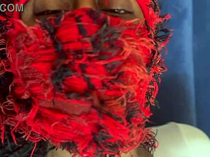 ebony woman masturbates with vibrator in shorts