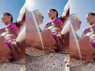 Watch this sexy latina get fingered on the beach?