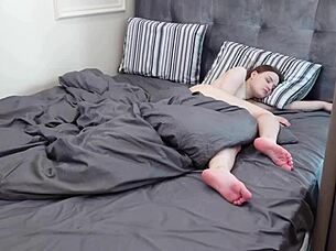 Cute teen giving footjob to older man