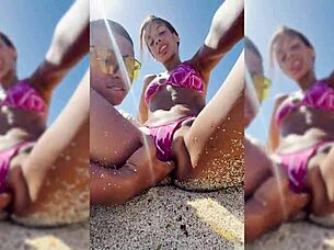 Watch this sexy latina get fingered on the beach?