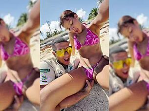 Watch this sexy latina get fingered on the beach?