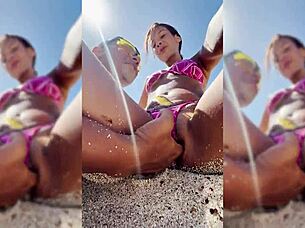 Watch this sexy latina get fingered on the beach?