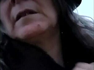 Female slave self-session in leather harness outdoors