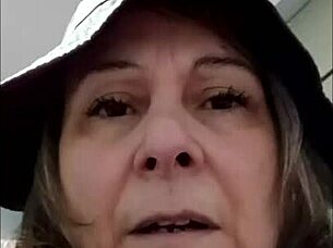 Female slave self-session in leather harness outdoors