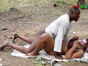 She demands hardcore banging from the group in the outdoor bush setting.