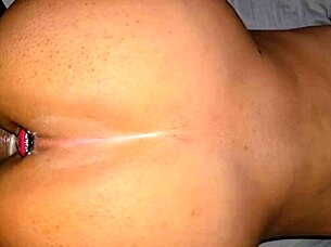 couple enjoys doggystyle with plug in anal play