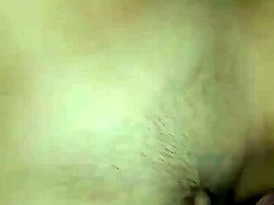 Asian woman with huge hairy beaver gets cum on belly during sex