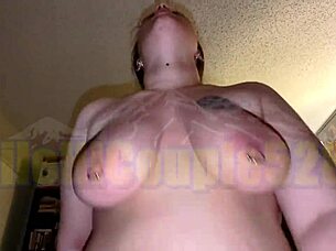 this amateur pawg with big pierced tits sucks a pierced cock and rides it hard, bouncing her boobs