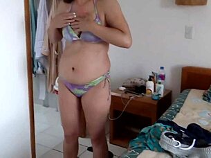 I record my stepmother putting on her bikini on the beach every day.