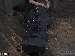 Girl is restrained in the garage and receives punishment for her actions