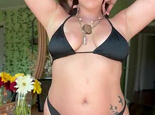 Hey, check out curvy pawg paisley flowers teasing in her black bikini on the beach