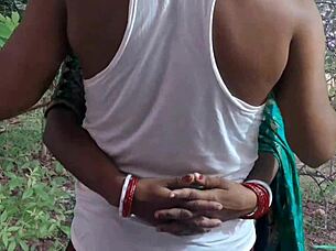 Desi hot Santhali bhabhi gets outdoor fucking with muscular bodybuilder, her big clit and hairy pussy exposed.