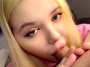 the blonde teen caresses her daddy's cock close up
