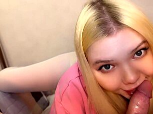 the blonde teen caresses her daddy's cock close up
