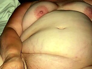 a fat bbw woman uses a vibrator to achieve orgasm in a private setting