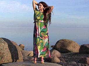 norma a masturbates sensually on the beach